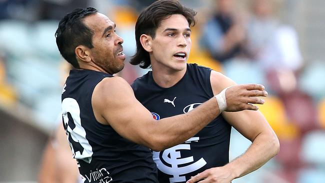 Eddie Betts of the Blues celebrates a goal with teammate Zac Fisher.