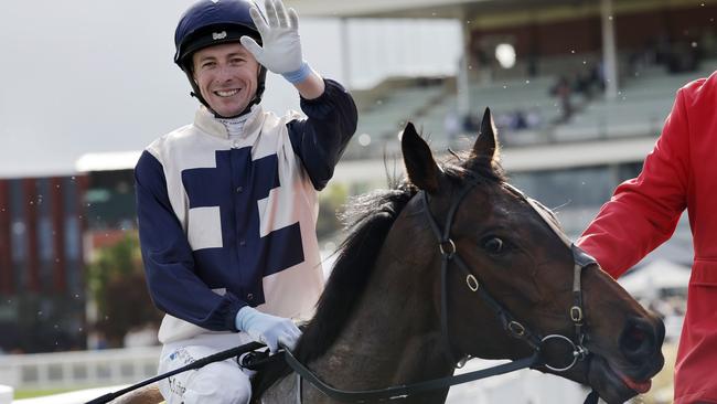 Harry Coffey savours the moment after winning the Caulfield Cup. Picture: Michael Klein