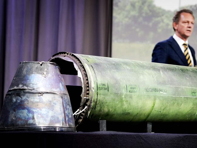 Head prosecutor Fred Westerbeke speaks next to a part of the BUK rocket that was fired on MH17. Picture: AFP