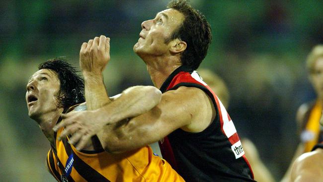 Steve Alessio jostles for position for Peter Everitt in a ruck contest.