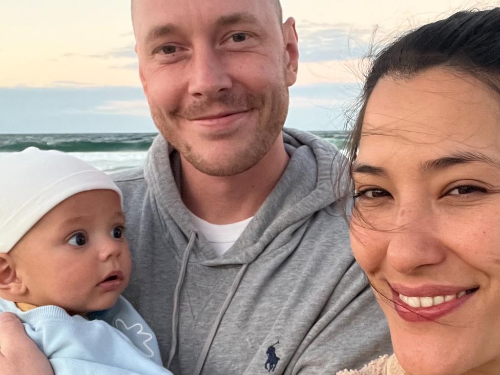 Lachlan Webb with his wife Claire and son Morrison