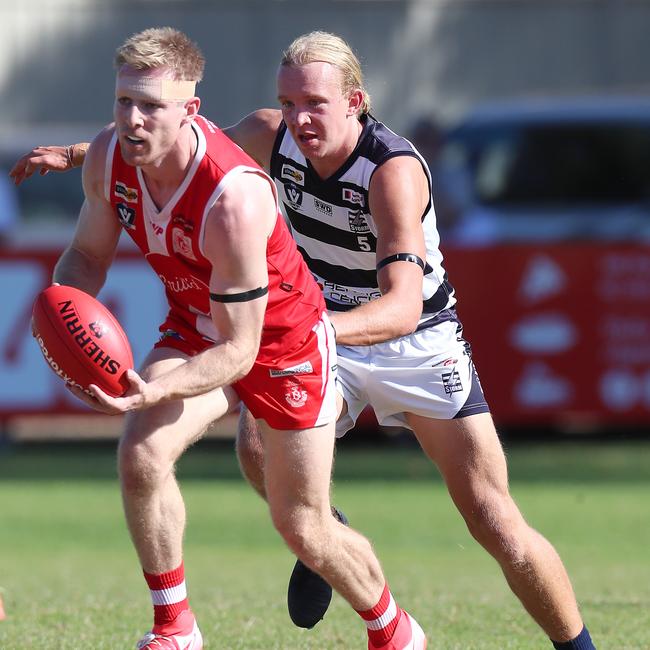 South Bendigo’s Joel Swatton leads Strathfieldsaye’s Mitch Hallinan to the ball.
