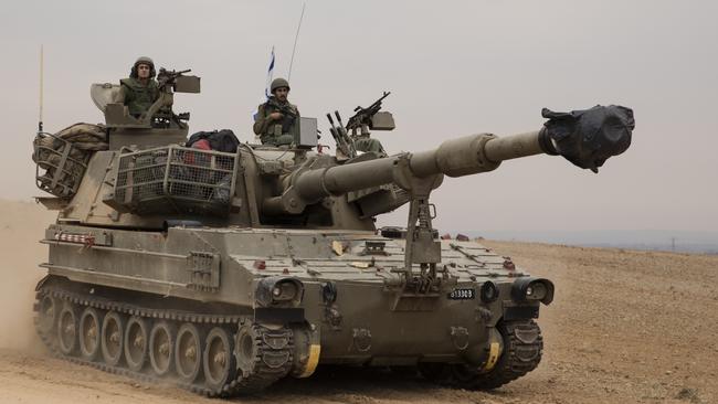 An Israeli tank drives toward the Israeli southern border with the Gaza Strip on Monday near Sderot. Picture: Getty Images