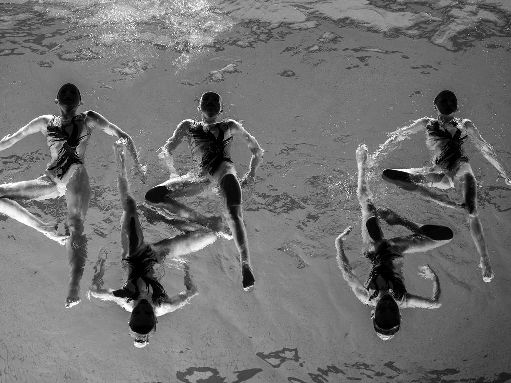 “Neptun Synchro” by photographer Jonas Lindkvist for Dagens Nyheter which won the third prize in the Sports Singles category shows members of the Neptun Synchro synchronized swimming team performing during a Christmas show in Stockholm, Sweden, on Dec. 13, 2015 (Jonas Lindkvist/Dagens Nyheter, World Press Photo via AP)
