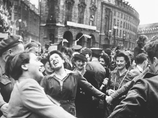 07/05/1945. Women join hands to celebrate VE Day marking end of World War two (II) in Europe in streets of London. England. WWII. 1945.