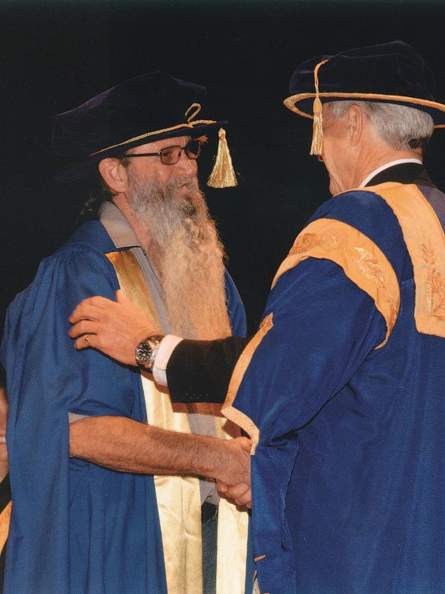 Smith receiving his doctorate in sociology.