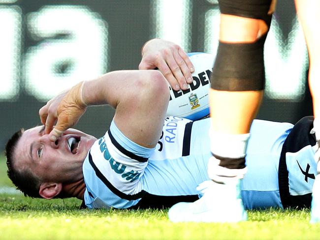 Gallen grabs at his face after being allegedly eye gouged by Luke Keary.