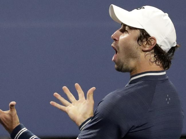 Jordan Thompson, of Australia, reacts after defeating Jack Sock, of the United States, in the fifth set of their first round match at the U.S. Open tennis tournament, Monday, Aug. 28, 2017, in New York. (AP Photo/Julio Cortez)