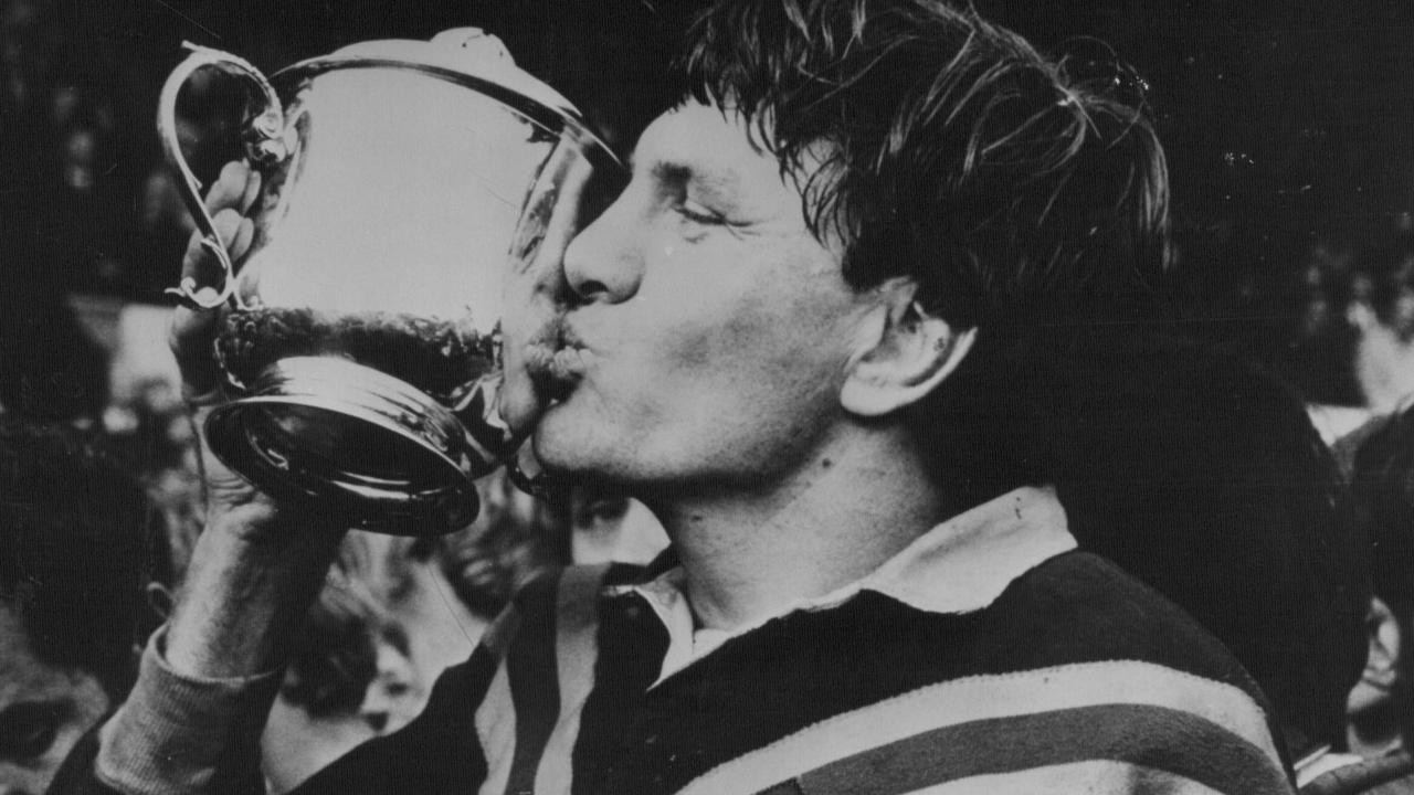 Captain Ron Coote kisses World Cup trophy after defeating England in final at Leeds.