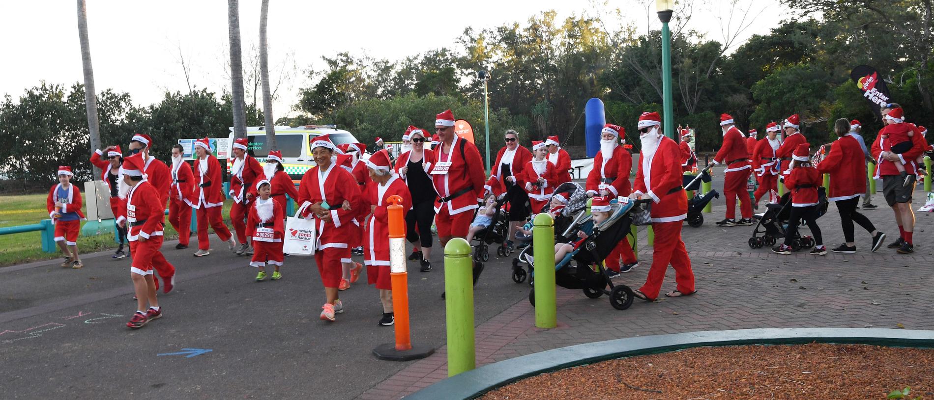 Participants set off for the Darwin Santa Fun Run in July at Mindil Beach. Picture Katrina Bridgeford.