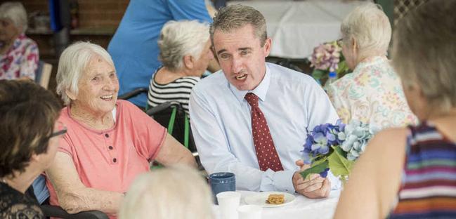 CUPPA AND A CHAT: Member for Page Kevin Hogan speaks with residents and carers at the Whiddon Group Aged Care Facility in Grafton, which is being expanded. Photo: Adam Hourigan