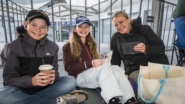 Oliver, 13 and Grace, 12 with their mum Victoria Moriaty were at Ninja Stadium at 7.15am to queue for BBL Grand Final tickets. Picture: Caroline Tan