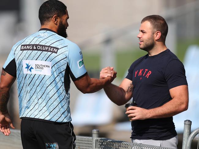 Injured Cronulla player Wade Graham speaks with Ricky Leutele during Cronulla Sharks training at Southern Cross Group Stadium, Cronulla. Picture: Brett Costello