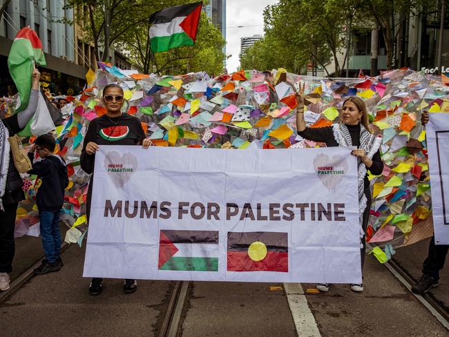 Mums for Palestine display a banner at the Pro-Palestine rally in Melbourne, surrounded by colourful kites symbolising children lost in Gaza. Picture: NewsWire