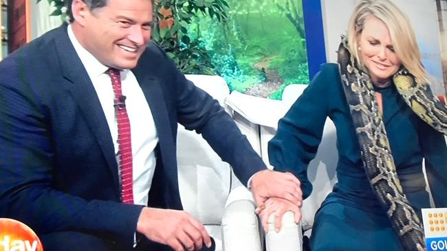 Karl gives his co-host a reassuring hand hold.