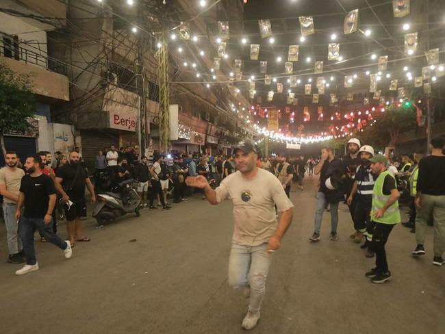 Emergency responders gather at the site of an Israeli strike on Beirut's southern suburbs. Picture: AFP