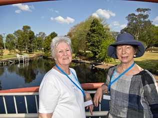 READY FOR THE CARNIVAL: New Zealand visitors Alison Read (left) and Sherry Bishop take in Lake Annand during a lunch stop on the first day of their week-long Carnival of Flowers tour. Picture: Kevin Farmer