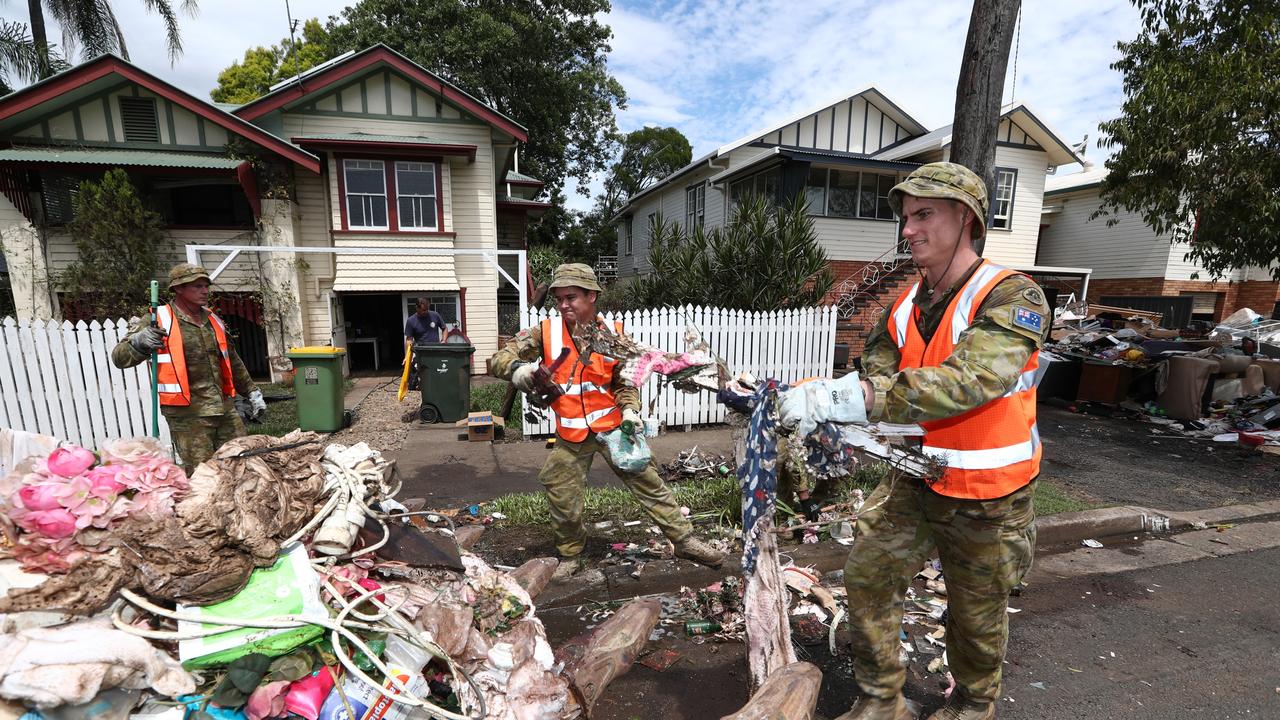 Defence Force Personel assist with the clean up in Lismore in the aftermath of the devastating floods. Photograph: Jason O'Brien