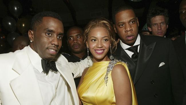 L-R: Sean "P. Diddy" Combs, Beyonce and Jay-Z at a 2004 party. Picture: Evan Agostini/Getty