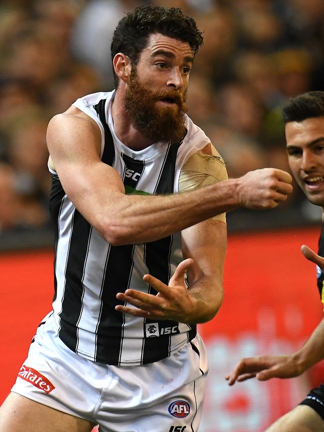 Tyson Goldsack clears by handball.