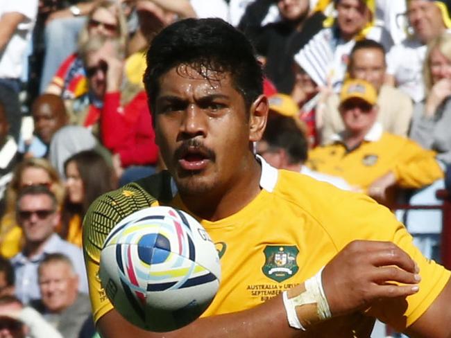 Australia's Will Skelton passes the ball during the Rugby World Cup Pool A match between Australia and Uruguay at Villa Park, Birmingham, England, Sunday, Sept. 27, 2015. (AP Photo/Martin Cleaver)