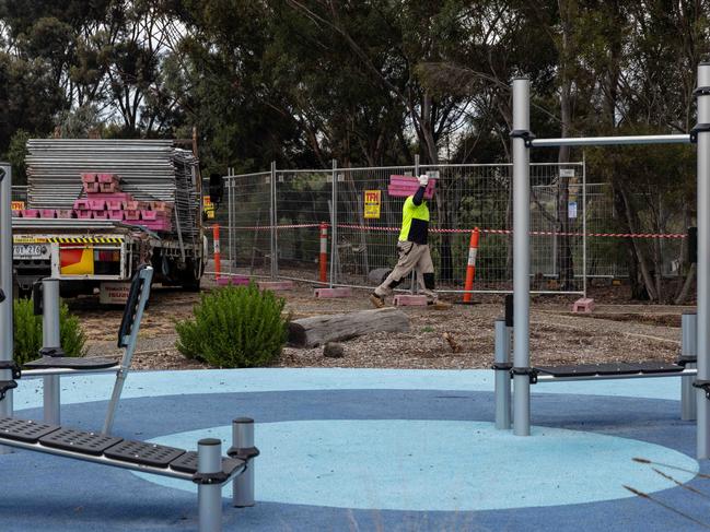 Contractors have put up fences around an area close to playgrounds at an Altona park. Picture: NCA NewsWire / Diego Fedele