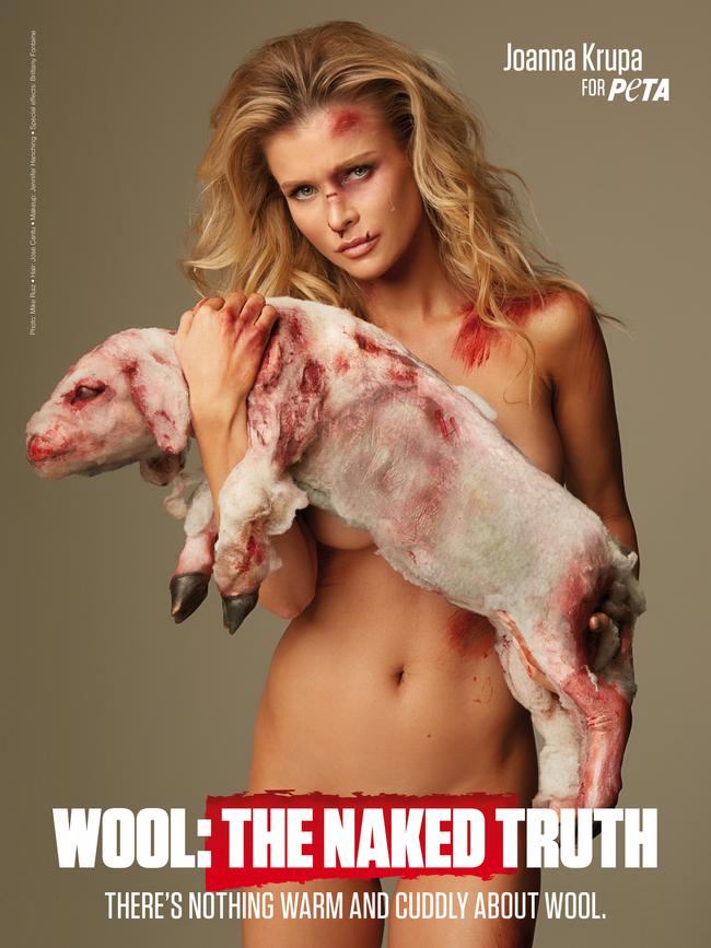 US actor Joanna Krupa holds a fake lamb as part of a Peta campaign to end mulesing.