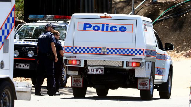 Police and inspectors from other agencies at the Dreamworld site. Photo: David Clark