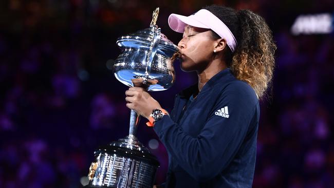 Japan's Naomi Osaka with the championship trophy.