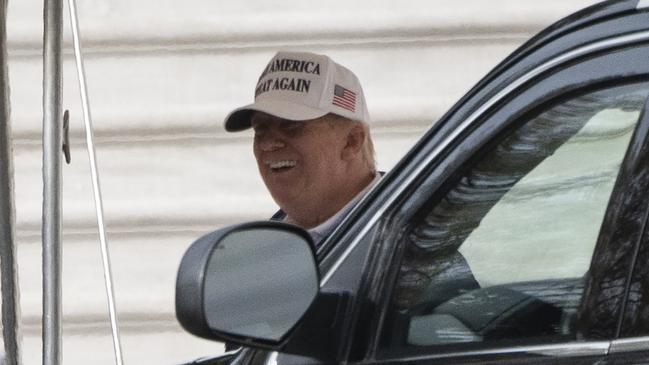 US President Donald Trump smiles as he departs the White House. Picture: AFP/ NOLDS / AFP)