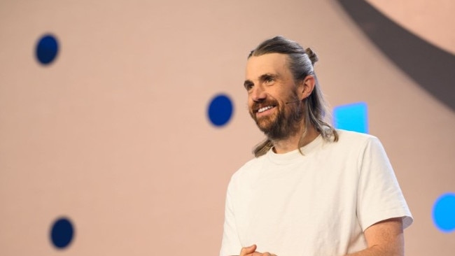 Mike Cannon-Brookes is spending big on AI to strengthen the company amid a ‘turbulent’ global economy.