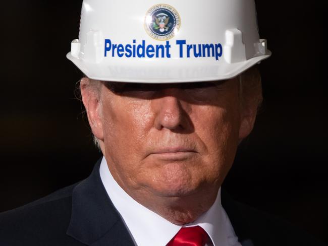 AFP presents a retrospective photo package of 60 pictures marking the 4-year presidency of President Trump.  US President Donald Trump tours US Steel's Granite City Works steel mill in Granite City, Illinois on July 26, 2018. (Photo by SAUL LOEB / AFP)