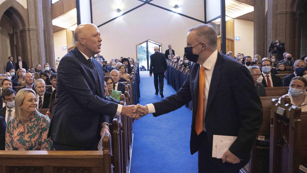 Mr Albanese and Mr Dutton shake hands at a church service in Canberra. Picture: NCA NewsWire / Gary Ramage