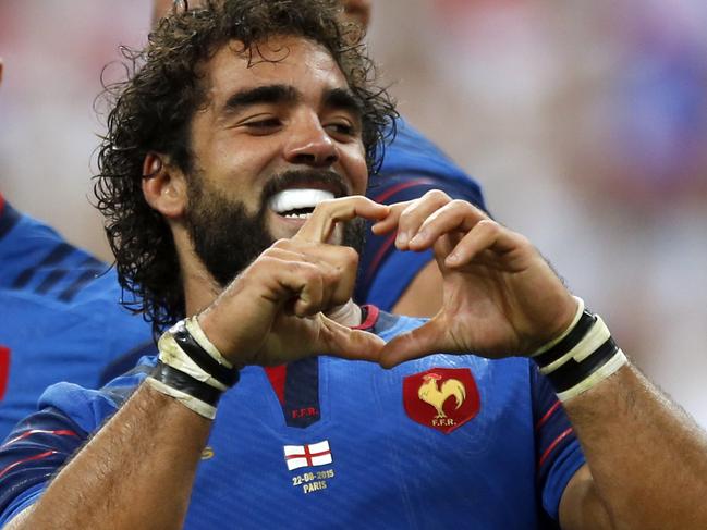 France’s Yoann Huget celebrates after he scores a try during the France vs England rugby friendly match at Stade de France in Saint Denis, north of Paris, France, Saturday Aug. 22, 2015. France is playing England in a series of friendly rugby internationals being held in advance of the upcoming Rugby World Cup that starts in September. (AP Photo/Francois Mori)