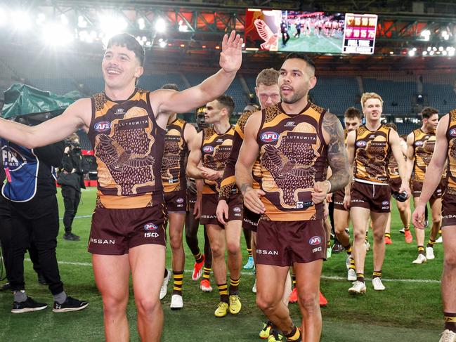 MELBOURNE, AUSTRALIA - MAY 26: Massimo D'Ambrosio and Jarman Impey of the Hawks leave the field after a win during the 2024 AFL Round 11 match between the Hawthorn Hawks and the Brisbane Lions at Marvel Stadium on May 26, 2024 in Melbourne, Australia. (Photo by Dylan Burns/AFL Photos via Getty Images)