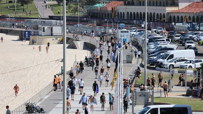 Lunch time at Bondi beach, in the city’s east. Picture: John Grainger