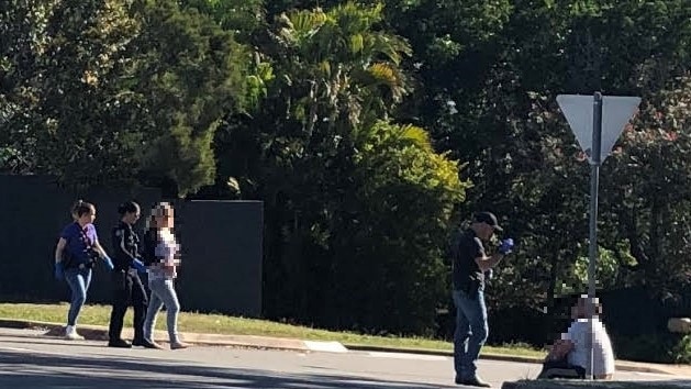 Police took multiple people into custody after raiding a house in Arana Hills. Photo: Kara Sonter