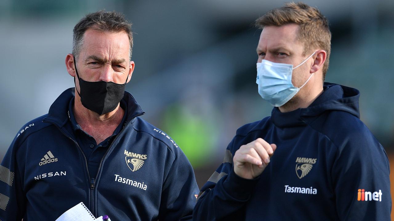 LAUNCESTON, AUSTRALIA - AUGUST 01: Alastair Clarkson Head Coach of the Hawks and Sam Mitchell, Head of Development of the Hawks are seen during the round 19 AFL match between Hawthorn Hawks and Brisbane Lions at University of Tasmania Stadium on August 01, 2021 in Launceston, Australia. (Photo by Steve Bell/AFL Photos/via Getty Images)