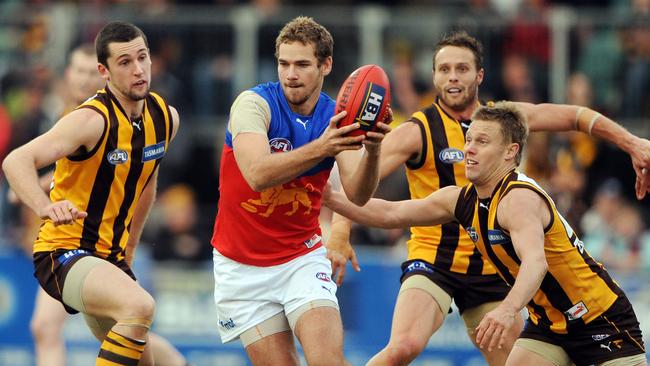 Jared Brennan remains the Territory’s highest draft pick (No.3 in 2002). And he showed why. as in this passage of play when evading multiple Hawthorn opponents while playing for Brisbane. Picture: Michael Dodge