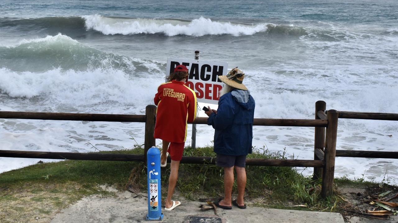 Main beach in Byron Bay remained closed but many visitors and residents decided to go and check out the high tide on Tuesday morning.