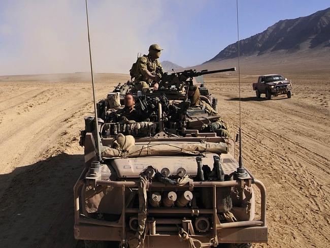 Australian Army soldiers travel through the desert in a long-range patrol vehicle during a Special Operations Task Group counter-insurgency operation in Uruzgan province, Afghanistan.  (This image has been digitally altered for operational security.) *** Local Caption *** Australian Army soldiers from Special Operations Task Group (SOTG) along with Afghan Nation Security Forces conducted a counter-insurgency operation over several days in northern Uruzgan province, Afghanistan.  Operation Slipper is Australia's military contribution to international campaigns against terrorism, countering piracy in the Gulf of Aden, and maritime security. Under this operation, Australian forces contribute to the efforts of the NATO-led International Security Assistance Force in Afghanistan, aiming to bring security, stability and prosperity to the country and prevent Afghanistan again becoming a safe haven for international terrorists.   Australian forces are also contributing to the US-led International Coalition Against Terrorism efforts across the Middle East.  SOTG comprises personnel from 1st Commando Regiment, Special Air Service Regiment, 4th Battalion (Commando) of the Royal Australian Regiment, Incident Response Regiment, Special Operations Logistics Squadron and a variety of supporting units from the ADF. Picture: Department of Defence