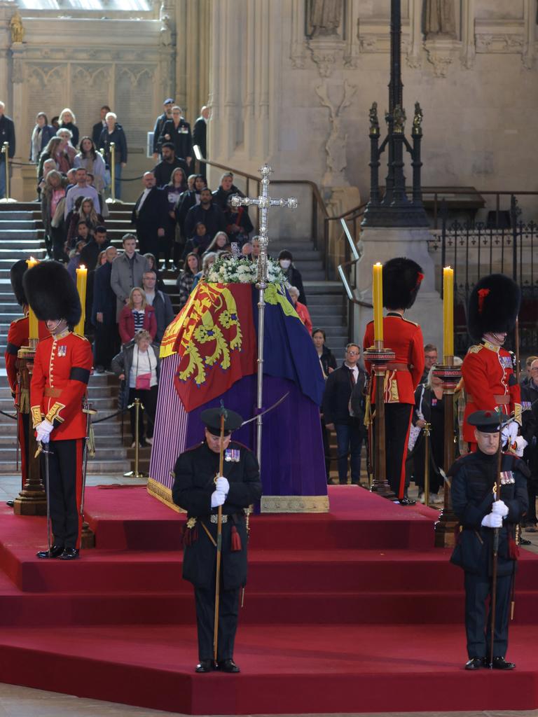 The coffin of Queen Elizabeth II, draped in the Royal Standard with the Imperial State Crown and the Sovereign's orb and sceptre, now lay there. Picture: Marko Djurica/WPA Pool/Getty Images