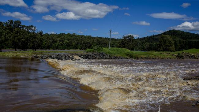 Water flowing over the Oxenford weir after the recent heavy rainfall. Picture: Jerad Williams