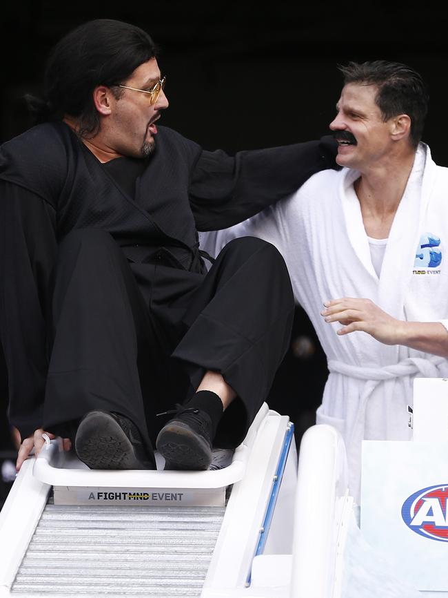 Brendan Fevola as Steven Seagal greets Nick Riewoldt. Picture: AAP