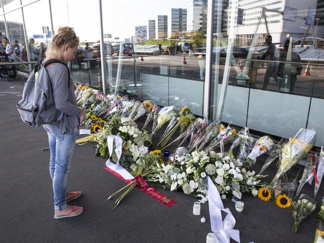 Flowers in front of terminal 3 at Schipol Airport in Amsterdam from where MH17 flight departed. Picture: Ella Pellegrini