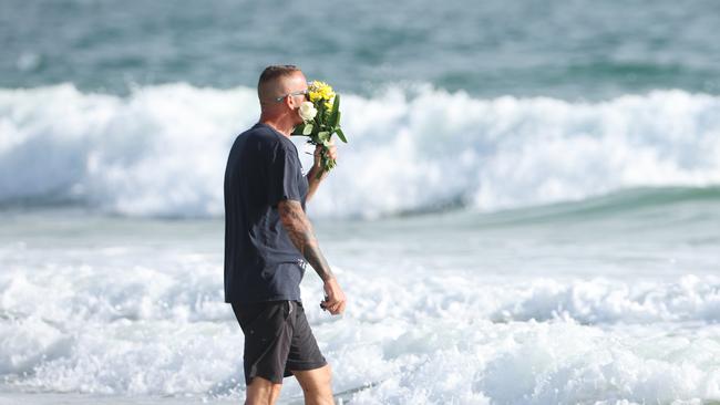 John Wadey who witnessed the shark attack that killed 17 year old local Charlie Zmuda returns to Woorim Beach to pay his respects on Tuesday morning. Picture Lachie Millard