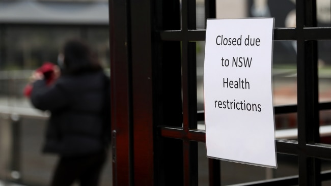 The premier said she "can't see how we would be in a position to ease restrictions by next Friday" unless there is a dramatic turnaround in numbers. A closed sign is displayed in Chatswood on Thursday during lockdown. Photo: Brendon Thorne/Getty Images