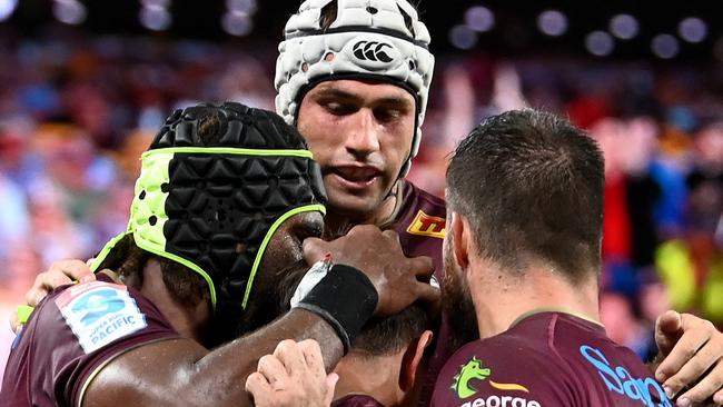 BRISBANE, AUSTRALIA - MARCH 26: Reds players celebrate a try during the round six Super Rugby Pacific match between the Queensland Reds and the NSW Waratahs at Suncorp Stadium on March 26, 2022 in Brisbane, Australia. (Photo by Dan Peled/Getty Images)