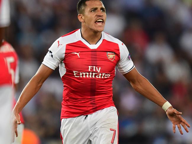 Arsenal's Chilean forward Alexis Sanchez reacts during the UEFA Champions League Group A football match between Paris-Saint-Germain vs Arsenal FC, on September 13, 2016 at the Parc des Princes stadium in Paris.  AFP PHOTO / FRANCK FIFE