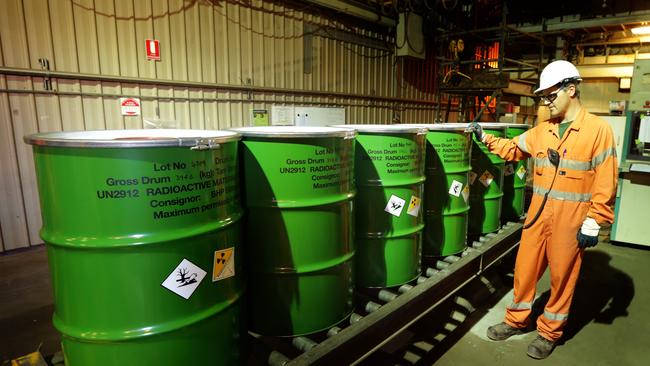 Adrian Boulton checks the packaged barrels of Uranium at BHP Billiton's Olympic Dam project in South Australia. The mine produces Copper, Gold, Silver &amp; Uranium.